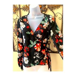 Floral top by Express. Size S/P. Long sleeve wrap style. New w/o tags.